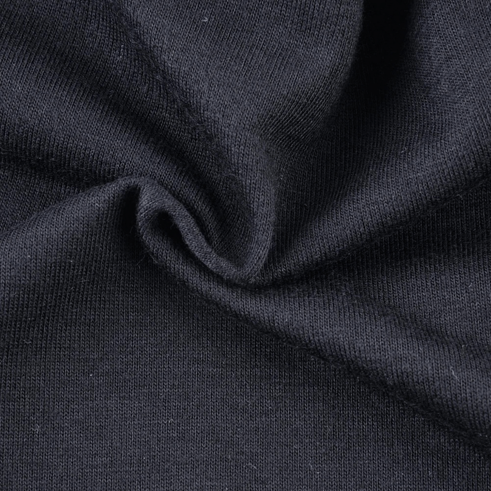 Close-up of black knit fabric texture for unisex beanie